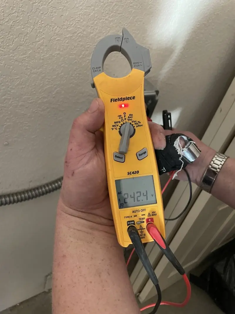 Voltage testing with clamp meter during Generator Installation in Clyde